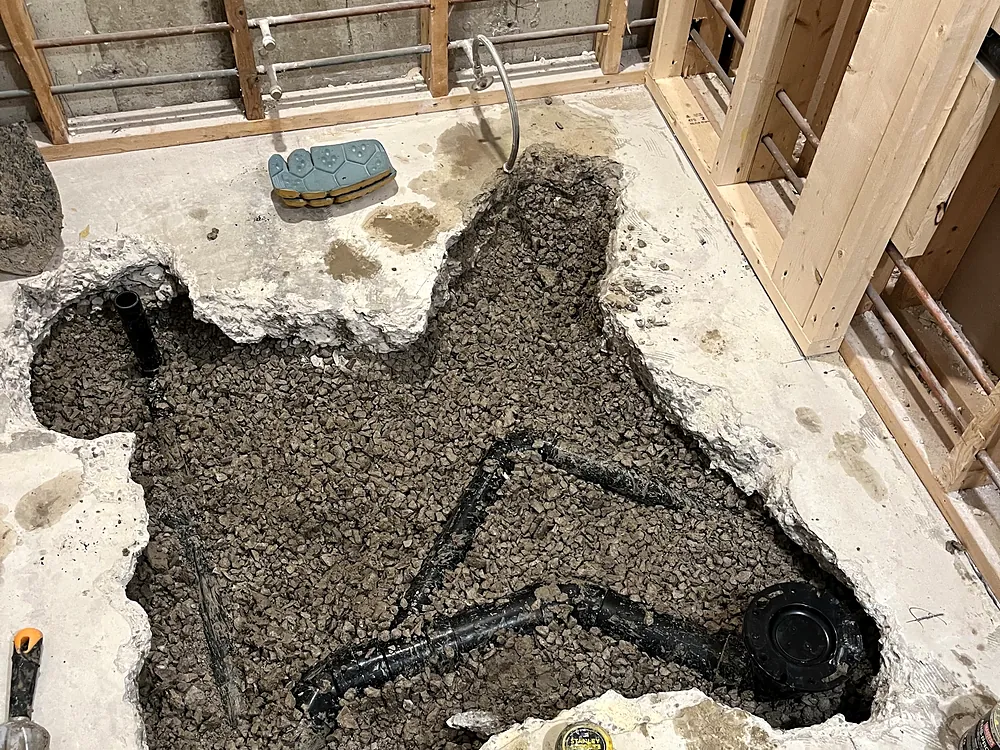 Basement floor opened up for new underground drain piping