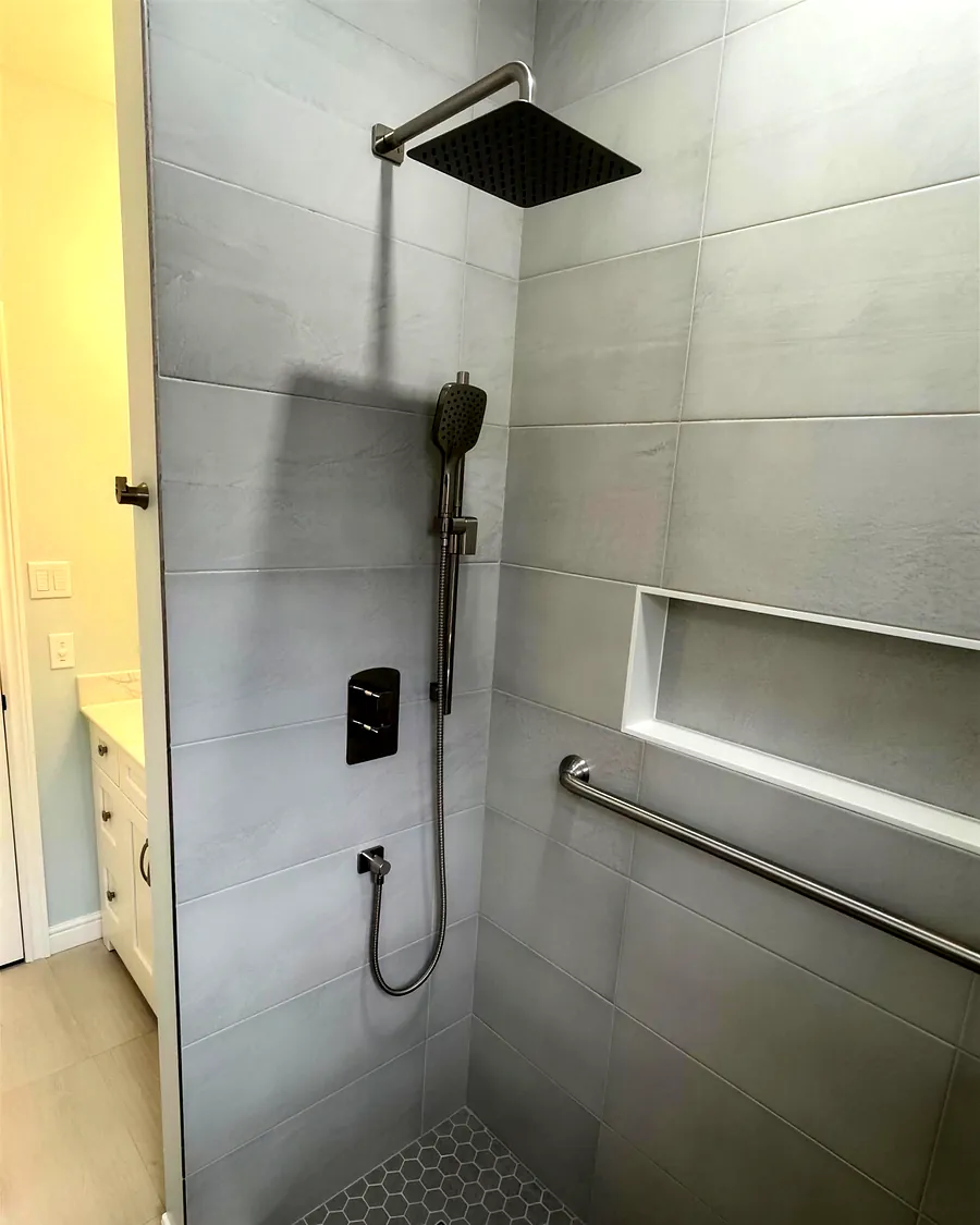 Finished walk-in shower with rain head and hand shower